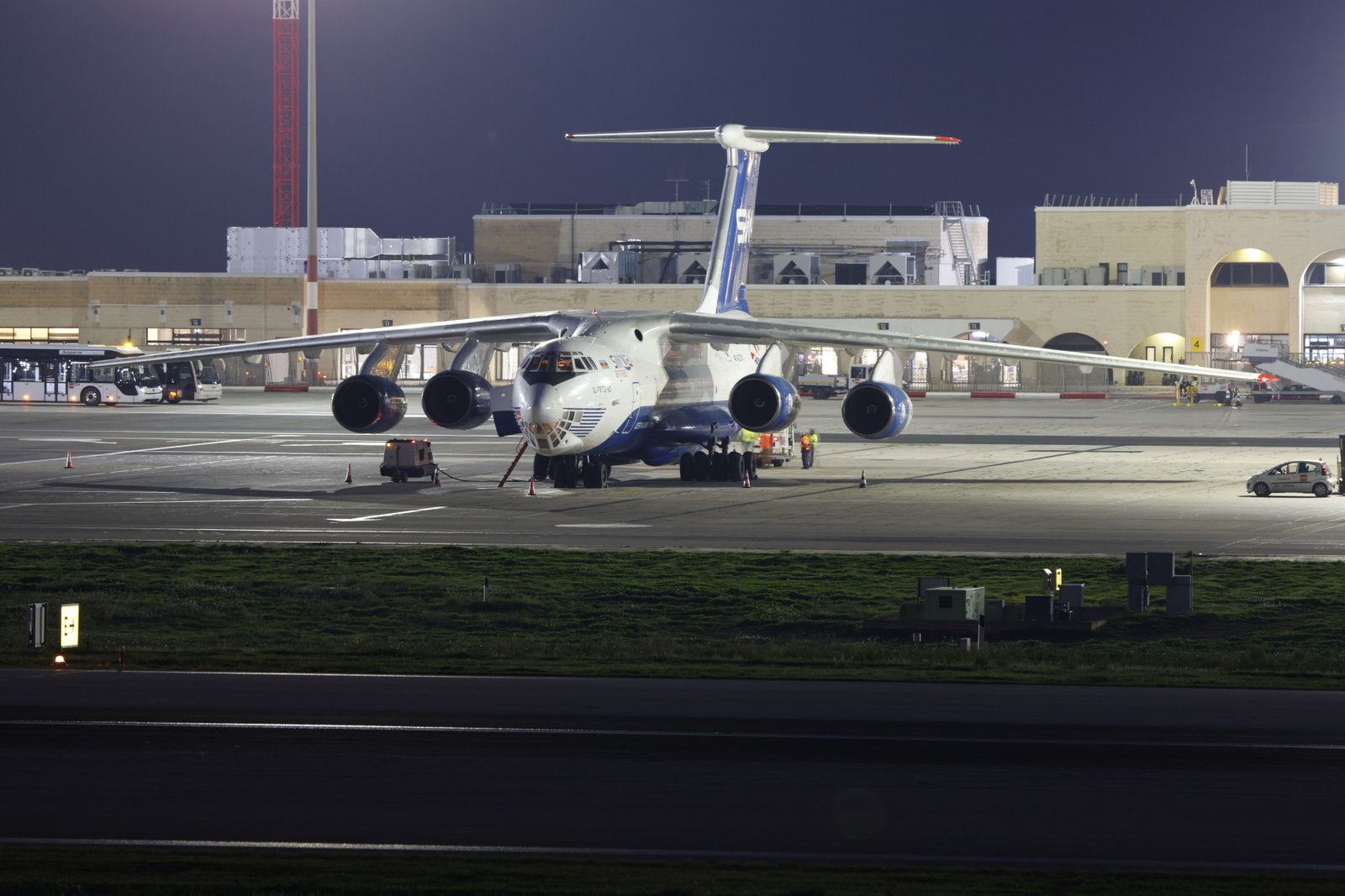 Cargo aircraft parked on an airport runway at night, representing air freight to Lilongwe