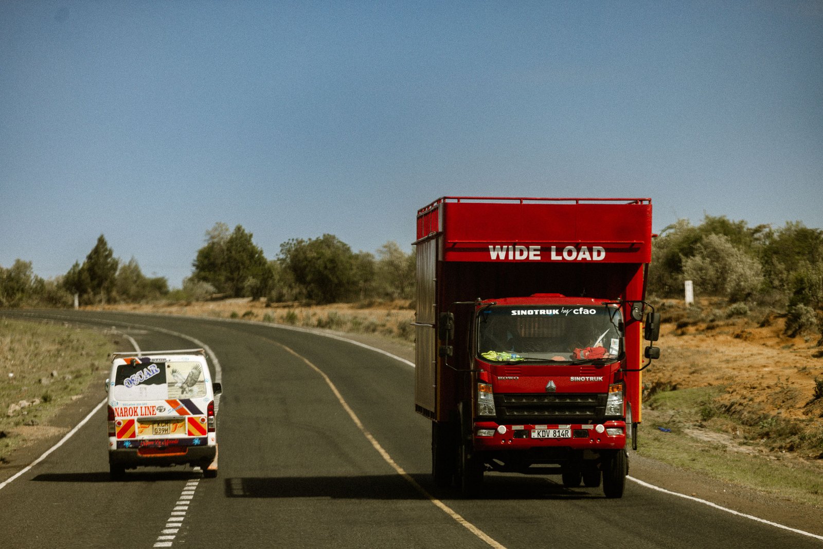 Freight truck driving on an open highway, representing road delivery to Lilongwe