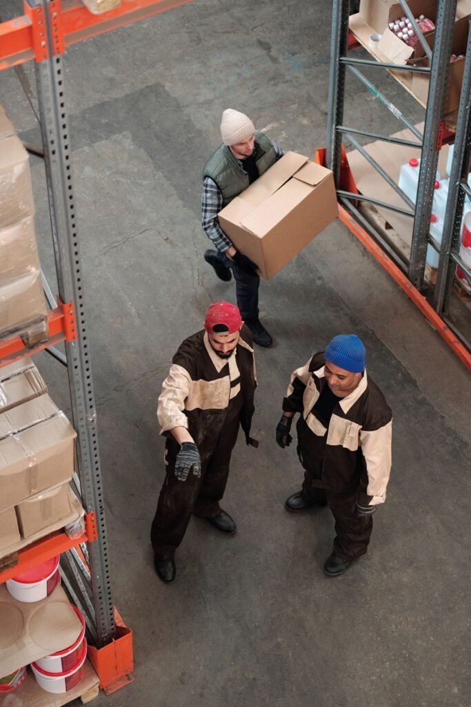 Warehouse workers handling and consolidating LCL cargo before shipping
