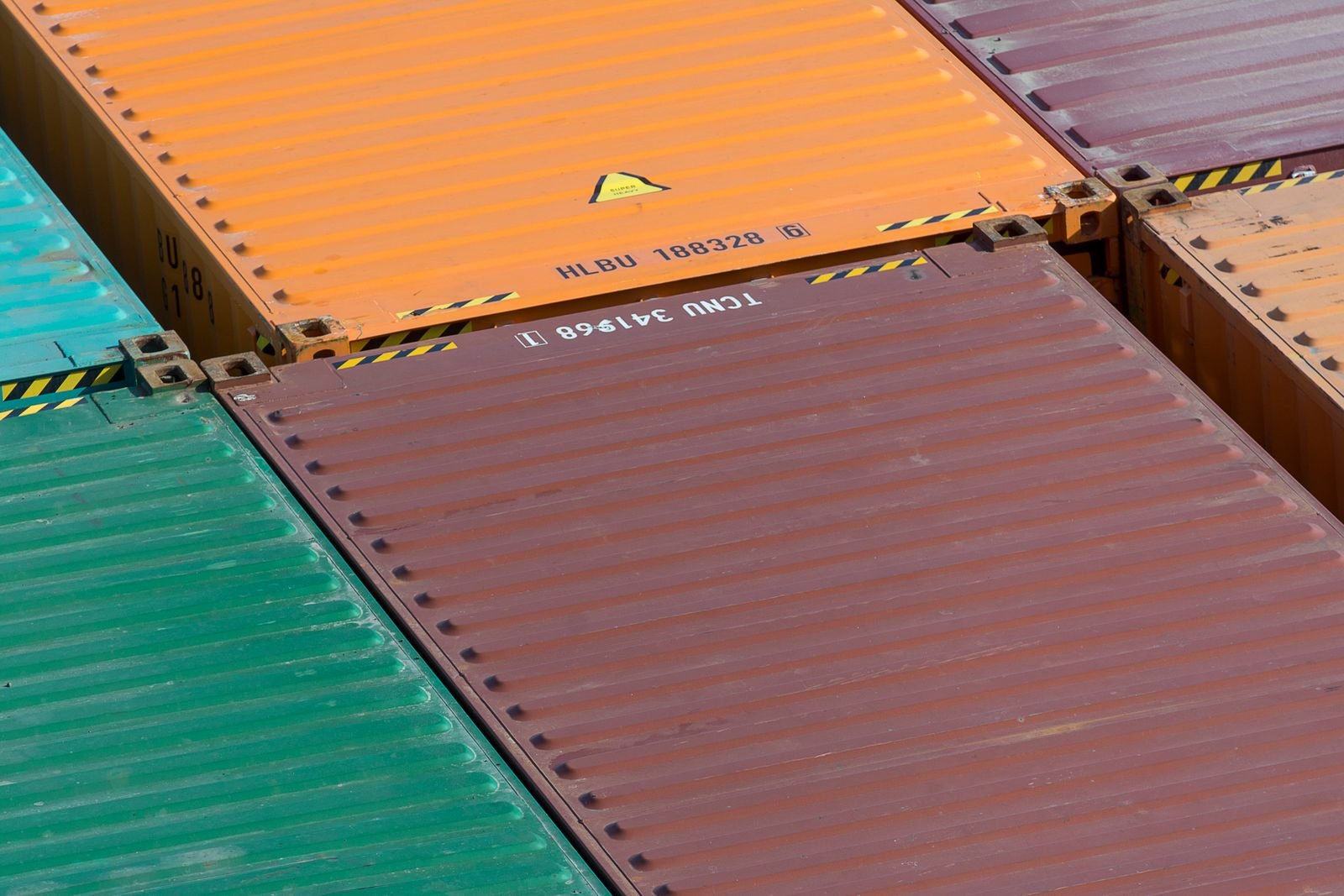Close view of colorful shipping containers stacked together