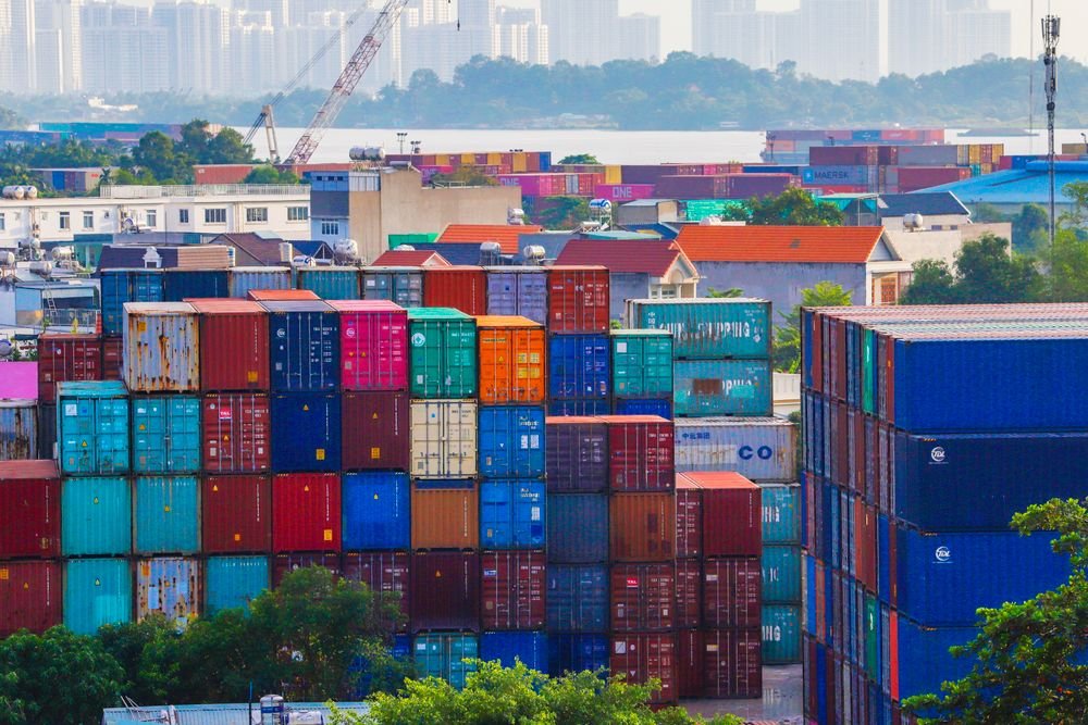 Aerial view of colorful stacked containers at a busy container port